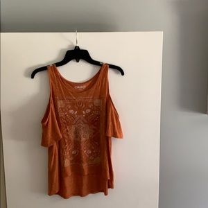 High-low tank top and it has a cold shoulder